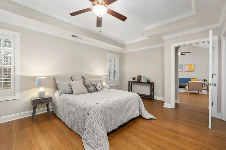 Neutral-toned bedroom with laminate flooring