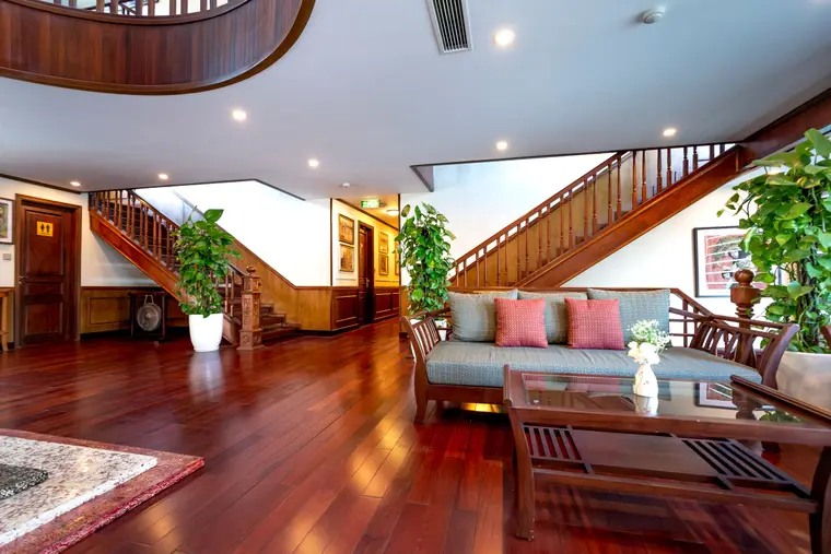Open living space with wood-look flooring and an open staircase